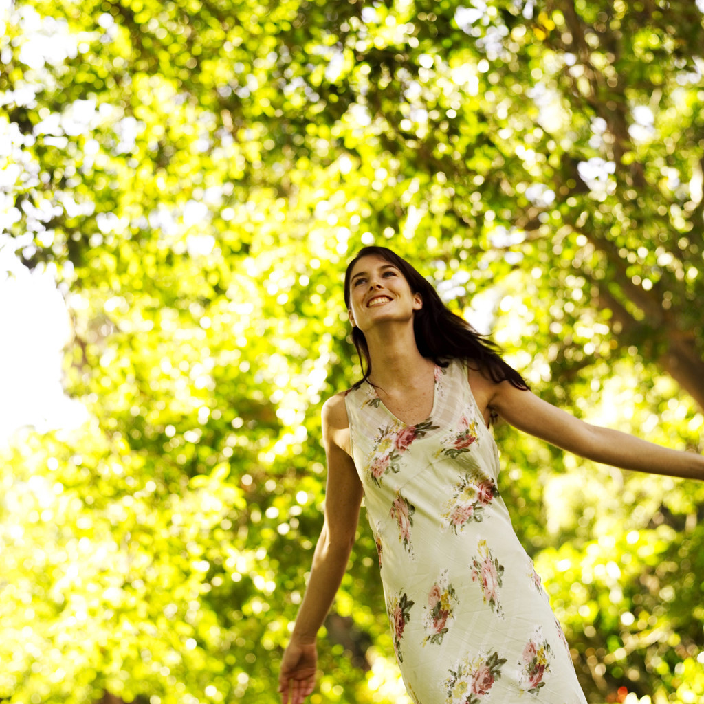 Young Woman Standing with Arms Stretched Out